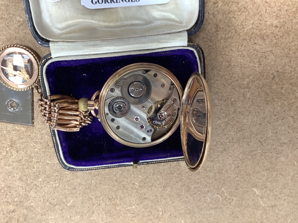 A 20th century 9ct gold hunter keyless pocket watch, on a 9ct gold chain with masonic charm